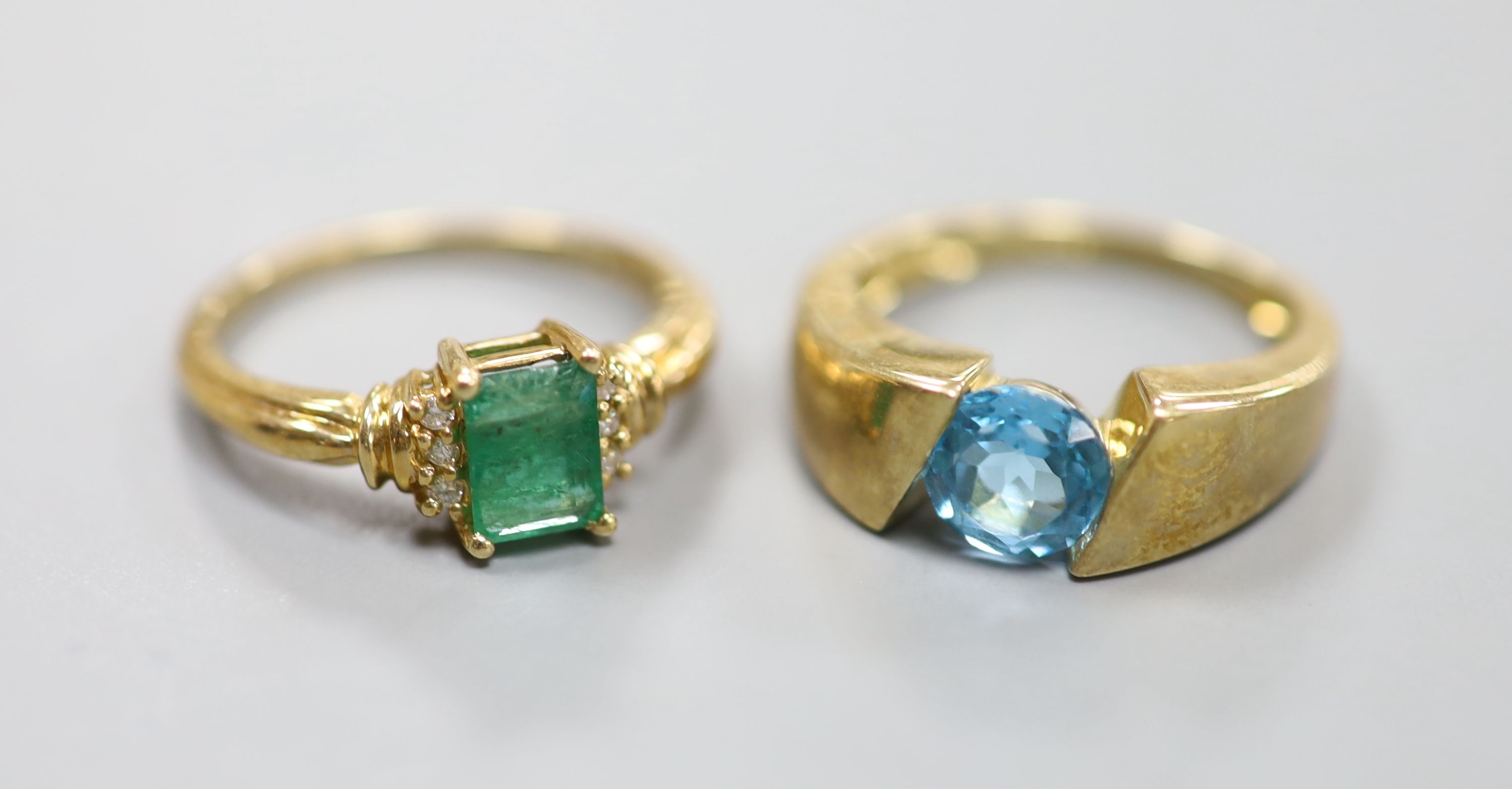 Two 9ct gold emerald-set rings and another 9k gem-set ring